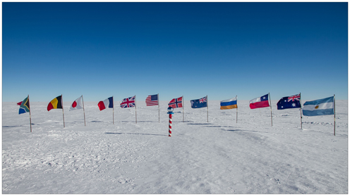 Flags from the 12 countries that participate in the experiment is standing in the ice
