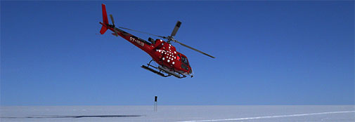 The Air Greenland helicopter taking off from camp.