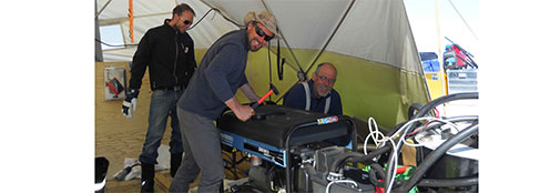Jan, Trevor, and Jakob repairing the generator? 