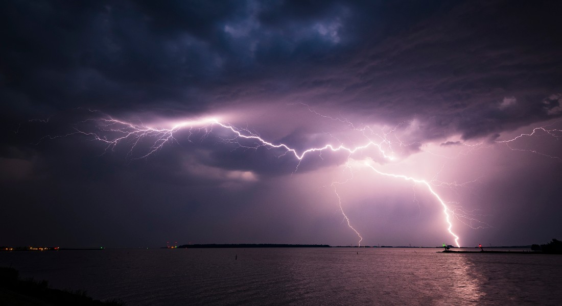 Photo of a dark sky with white lightening