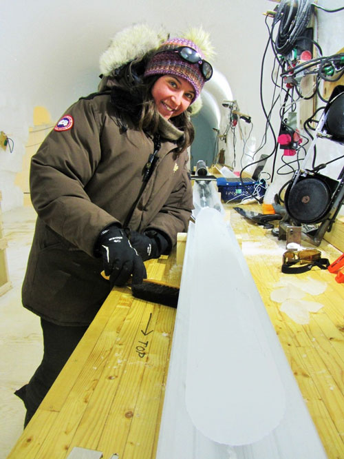 Emilie Capron next to an ice core in the ice-core laboratory