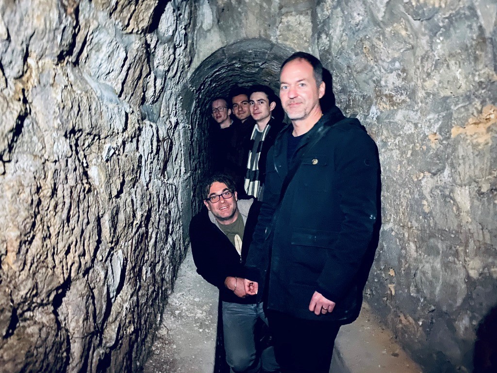 The catalog team goes exploring beneath the streets of Paris. Left to right: Olivier Kauffmann (LAM), Marko Shuntov (IAP), John Weaver (DAWN), Sune Toft (DAWN), and Olivier Ilbert (bottom; LAM). Photographer: Henry McCracken (IAP).