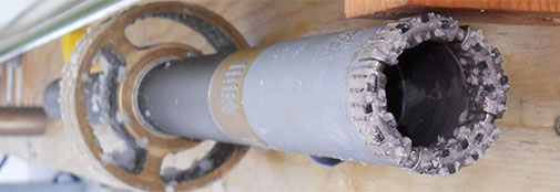 The rock drill head with basal material frozen on to it. The rock drill head with basal material frozen on to it.