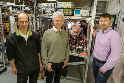 Members of the QUANTOP group who will be part of the ERC project QUANTUM-N: Associate Professor Jörg Helge Muller, Professor Eugene Polzik and Associate Professor Jürgen Appel. In the background are PhD students Christoffer Møller and Rodrigo Thomas.